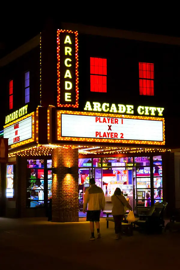 Arcade City marquee lit up at night