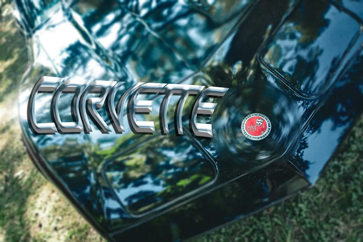 Chrome Corvette badge on a dark car body
